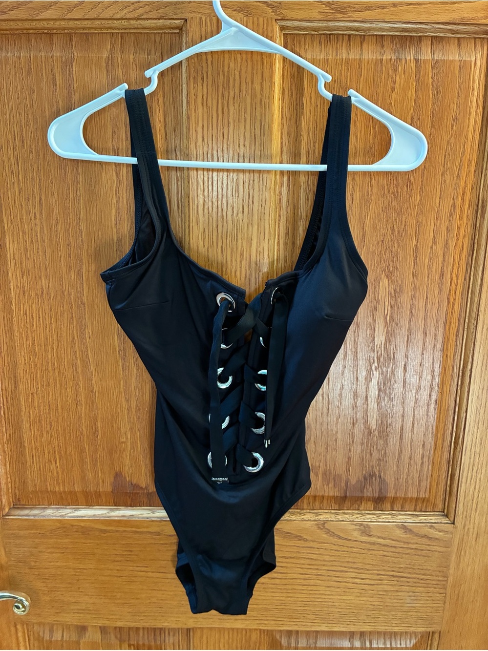 Michael Kors Lace-Up Grommet One-Piece Swimsuit.